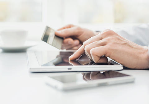 Making a payment in an app on a tablet Making a payment in an app on a tablet
